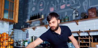 Bartender wiping down bar counter